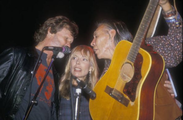 Kris Kristofferson, Joni and Floyd "Red Crow" Westerman performing.<br>  Photo by Lisa Law. 