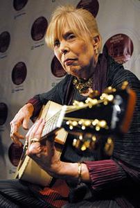 Joni Mitchell played a guitar, presented to her by Robin and Claude Boucher, in the media room prior to being inducted into the Canadian Songwriters Hall of Fame. Aaron Harris / CP 