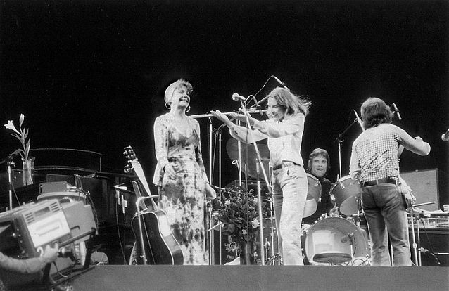 Joni sang Annie Ross's <i>Twisted</i> as an encore, then brought Annie herself on stage to take a bow. John Guerin on drums.  Photo by Vin Miles. 