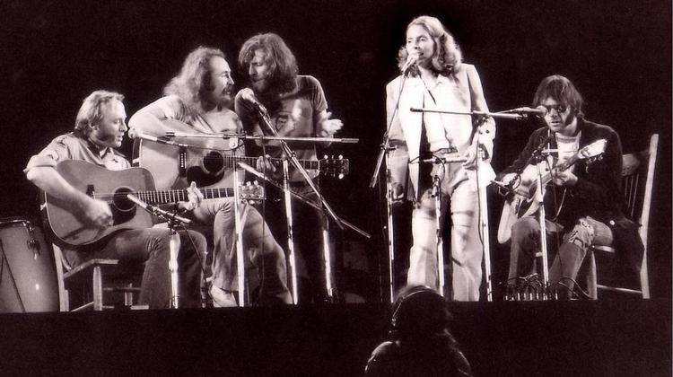 Joni with Crosby, Stills, Nash & Young. <br>Photo by Vin Miles.