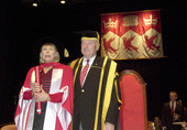 Joni receiving the degree from Dick Pound.