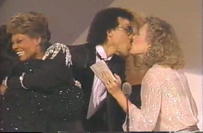 Joni gives Lionel a congratulatory kiss.